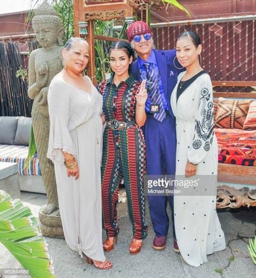 A picture of Miyoko Chilombo with her parents and sister Jhene Aiko.